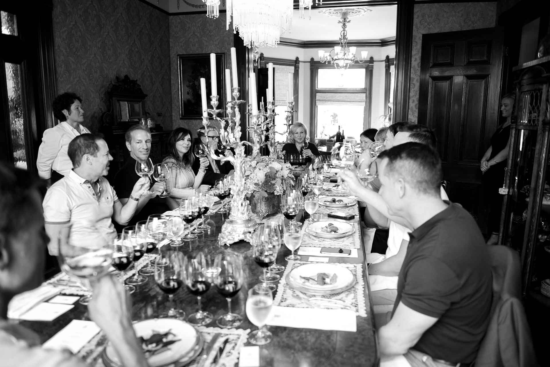 large group of guests sitting at dining table