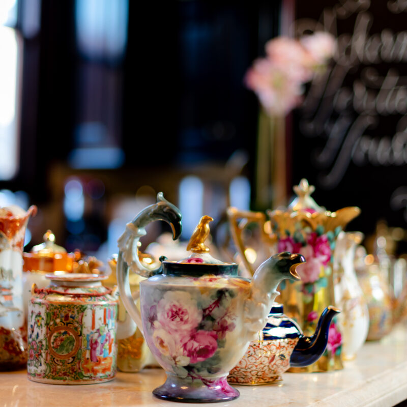 vintage tea set with florals painted on it